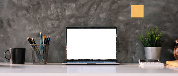 Text on table against wall at home