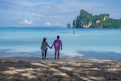 Rear view of women on beach