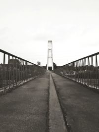 View of footbridge against clear sky