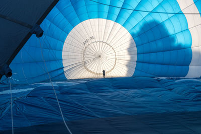 Close-up of blue parachute on ground