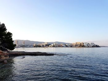 View of sea with city in background