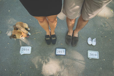 Low section of people standing on street