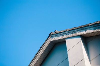 Low angle view of house against clear blue sky