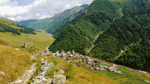 High angle view of green landscape against sky