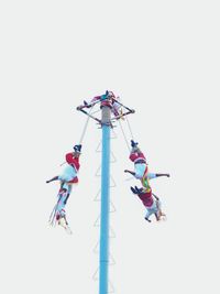 Low angle view of people on stage against clear sky