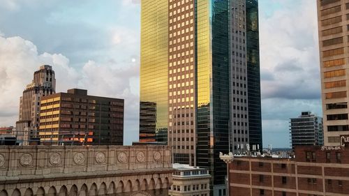 Low angle view of buildings in city against sky