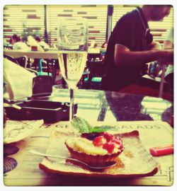 Woman eating food in restaurant