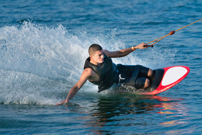 Full length of man surfing in sea