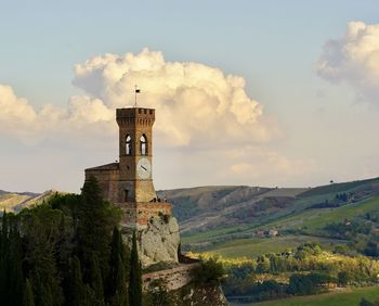 Castle on mountain against sky