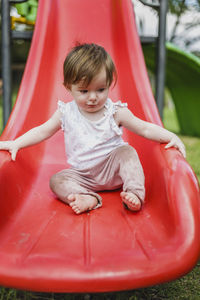 Portrait of cute girl playing on play ground