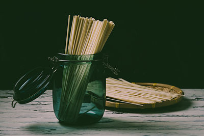 Close-up of bread on table against white background