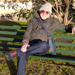 Portrait of woman sitting outdoors