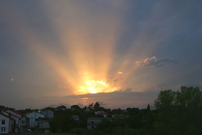 Silhouette of building against sky at sunset