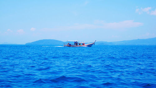 Boat in sea against sky