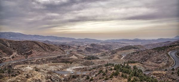 High angle view of mountain landscape against cloudy sky