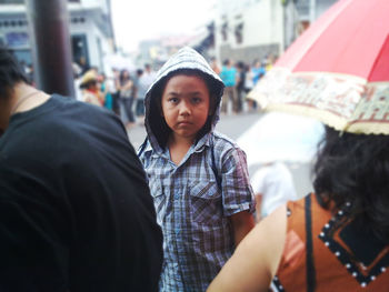 Portrait of boy walking on street