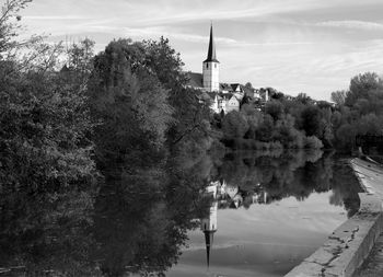 Panoramic view of trees and buildings against sky