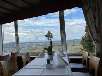 Panoramic view of building seen through glass window