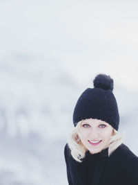 Portrait of mid adult woman in warm clothing