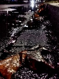 Close-up of wet car on street