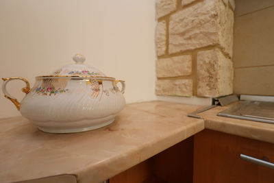 Close-up of tea cup on table at home