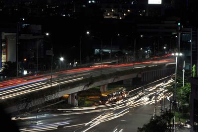 High angle view of light trails on road at night