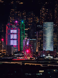 Illuminated buildings in city at night