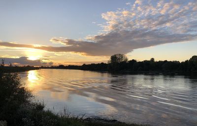 Scenic view of lake against sky during sunset