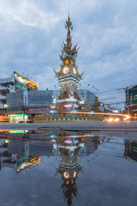 Reflection of illuminated building on water