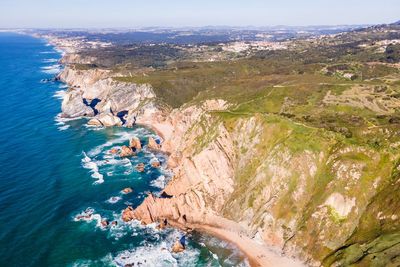 High angle view of rocks by sea