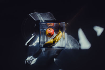 Fruits in container on table