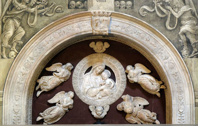 Madonna with four angels, tomb of filippo strozzi, santa maria novella church in florence, italy