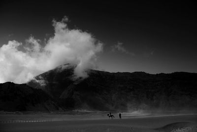 Scenic view of silhouette mountains against sky