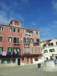 Houses against sky in city