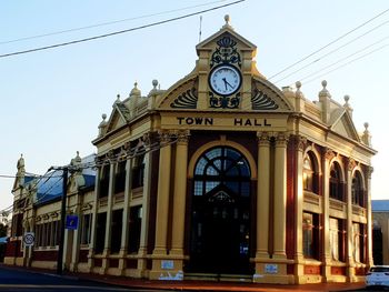 Low angle view of clock tower against sky