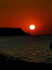 Scenic view of sea against romantic sky at sunset