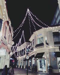 Buildings in city at night