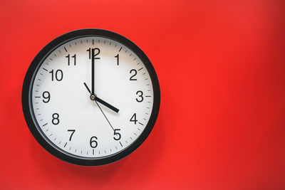 Close-up of clock on wall