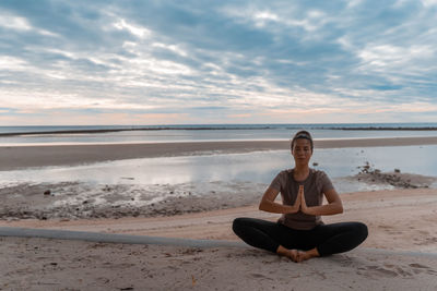 Yoga asanas on the background of dawn