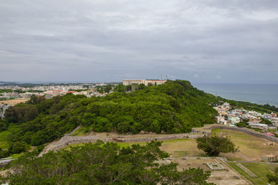 High angle view of trees and buildings against sky