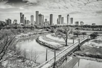 Panoramic view of river and city against sky