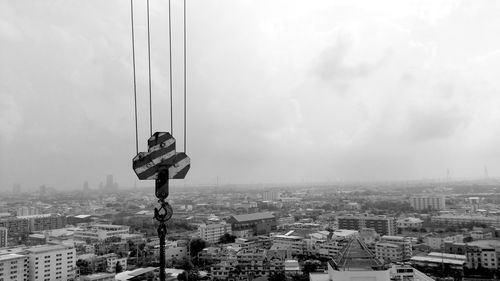 High angle view of city buildings against sky