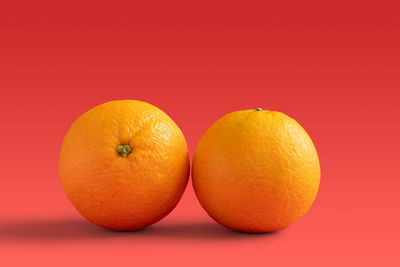 Close-up of oranges against orange background