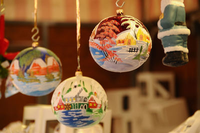 Close-up of christmas decorations hanging at market stall