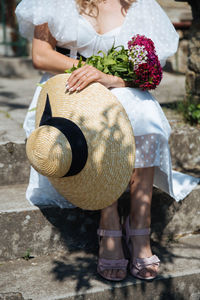 Low section of woman standing outdoors