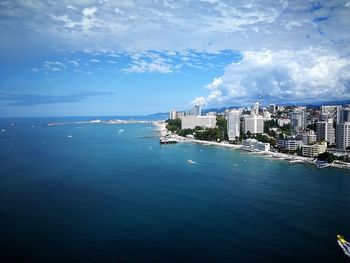 Scenic view of sea and buildings against sky