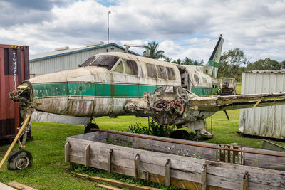 Abandoned truck on field against sky