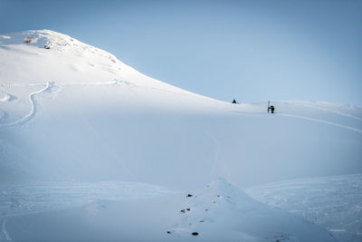 Scenic view of snow covered mountain against sky