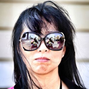 Close-up portrait of woman wearing sunglasses