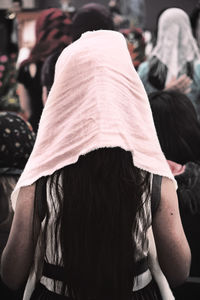 Rear view of woman wearing headscarf while standing outdoors